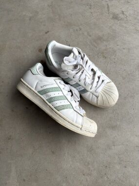 Women’s Adidas Superstar white and green trainers